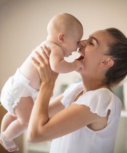 Mother and her baby boy at home.